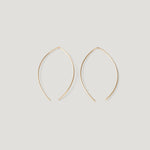 Pair of gold thread earrings in a pointed open-wire arc, laid flat.