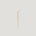 Gold earring with a freshwater pearl stud and fine chain tassel on light background
