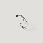 Single silver wire hoop earring shown from the side, close-up on light background.