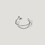 Single silver wire hoop earring viewed front-on, showing its open double-wire shape.
