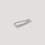Silver ear climber earring with row of small sparkling stones on white background