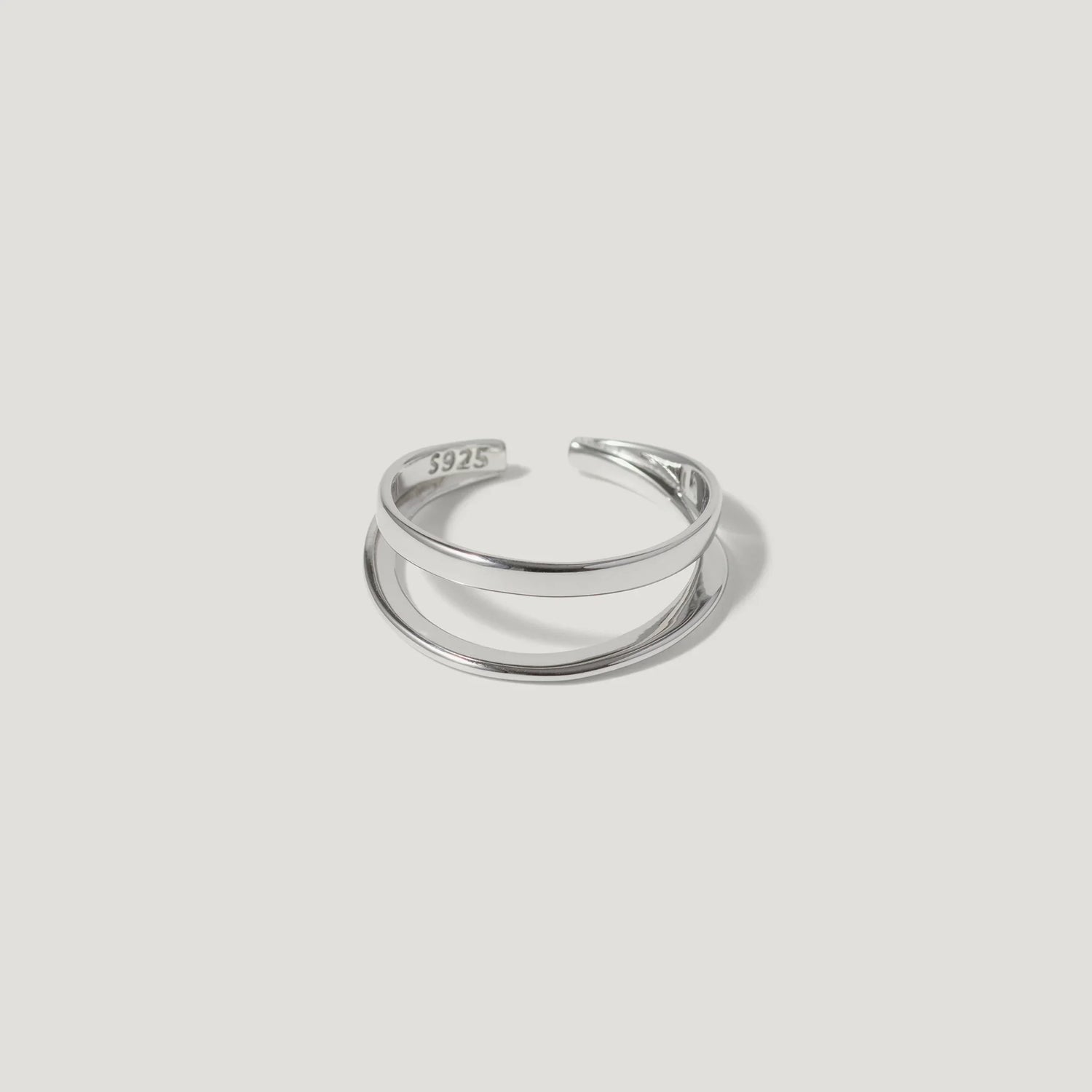 Sterling silver open band ring with minimalist double band design on white background