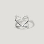 Modern open sterling silver ring with crossover design on white background