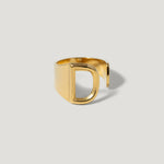 Gold open band ring with bold letter D design, modern minimalist jewelry on light background