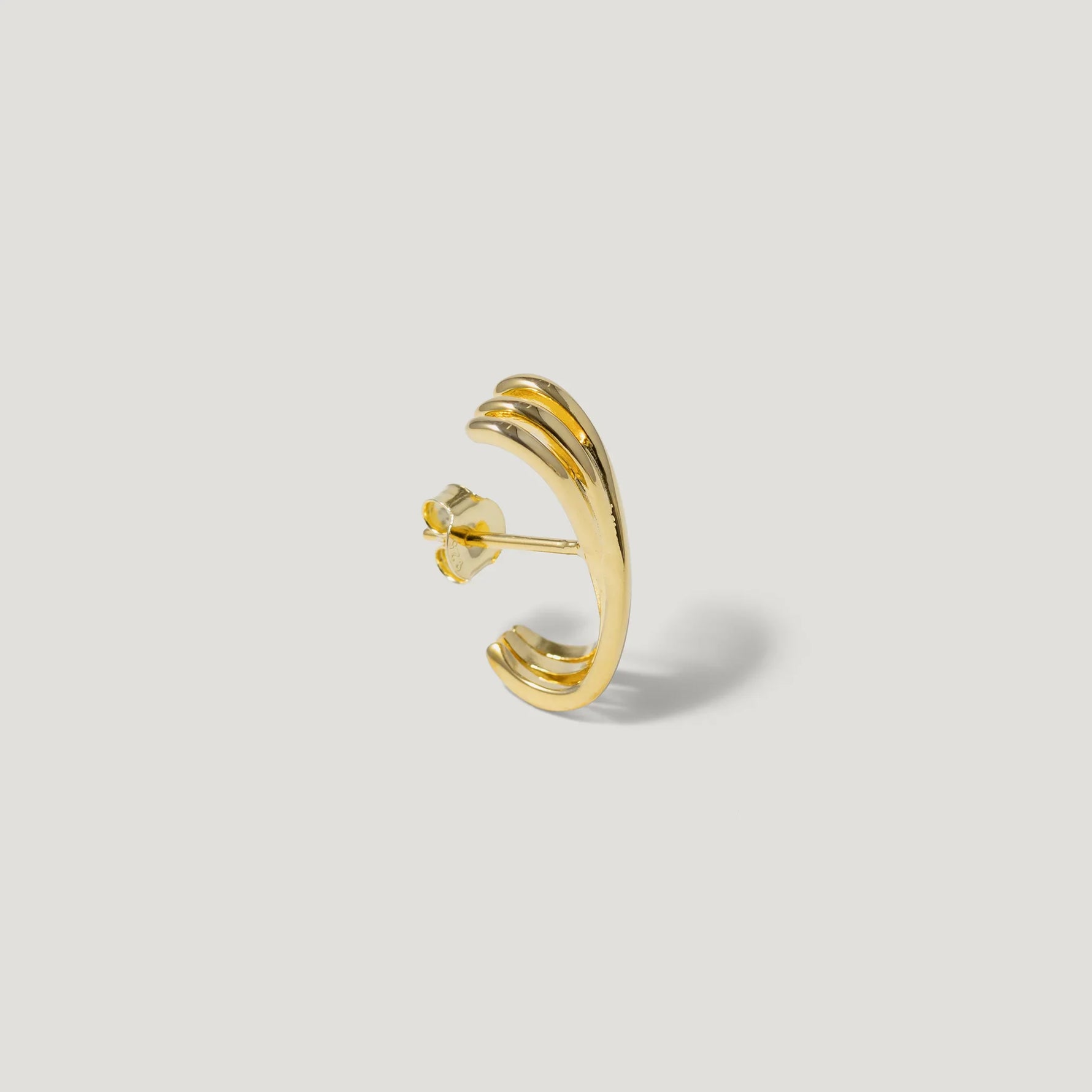 Gold-plated double band stud earring with polished finish on white background
