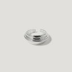 Chunky silver dome ring with layered bands on a white background
