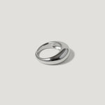 Polished silver dome ring with minimalist design on a light background