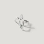 Sterling silver openwork ring with geometric floral design on white background