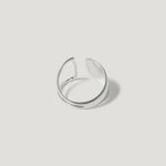 Minimalist open silver ring with smooth polished finish on white background