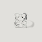 Modern openwork silver ring with abstract geometric design on white background