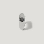 Minimalist silver ring with polished, chunky design on white background