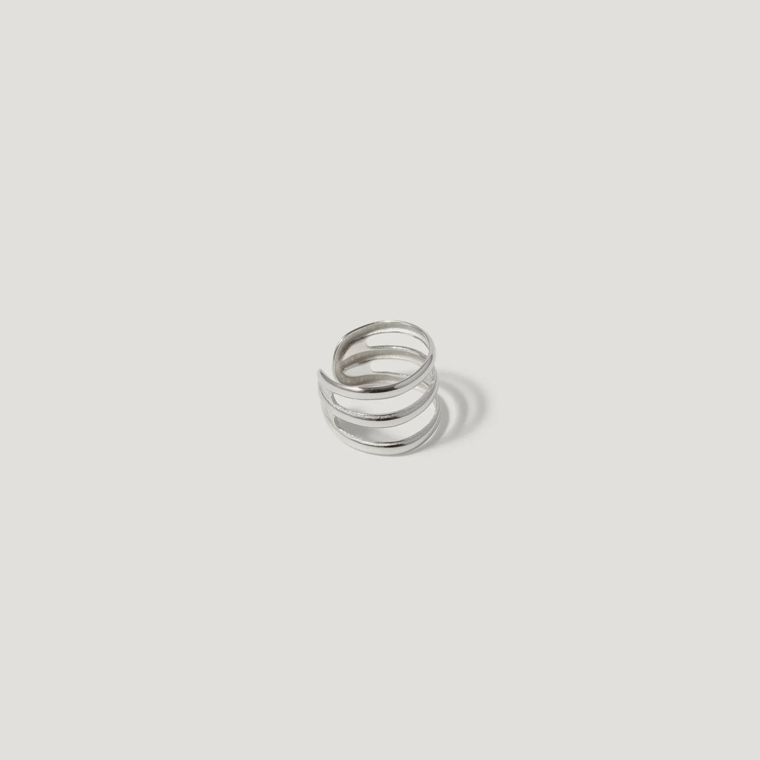 Minimalist silver open band ring on white background, modern jewelry design