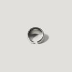 Sterling silver open band ring with textured design on white background