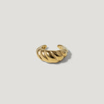 Chunky gold ear cuff with twisted rope design on white background