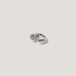 Abstract silver ring with organic, sculpted shape on white background