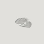 Sculptural silver cuff bracelet on a white background, modern jewelry design