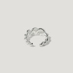 Sterling silver twisted open ring with polished finish on white background