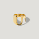 Minimalist open gold ring with a modern U-shaped design on a neutral background