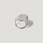 Contemporary silver statement ring with an open adjustable band and textured finish