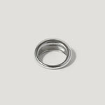 Polished silver dome ring with a smooth finish on a light grey background