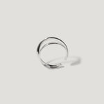 Minimalist silver open cuff ring on white background, modern jewellery design