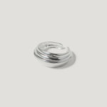 silver layered band ring with open back on white background