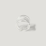 Textured sterling silver open band ring on a light background