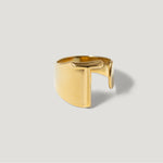 Modern gold open band ring with geometric cutout design on a light background