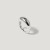 Minimalist chunky silver dome ring on a light grey background