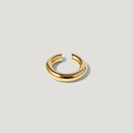 Minimalist gold chunky open hoop ring on light background