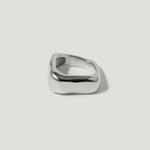 Modern chunky silver square ring with smooth, polished finish on white background