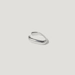 Minimalist silver open ring with smooth, modern design on white background