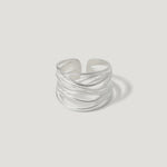 Sterling silver open band ring with layered, textured wire design on white background