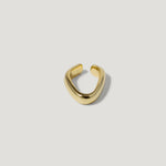 Minimalist gold open ring with a smooth, curved band on a white background