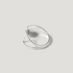 Modern silver open ring with minimalist geometric design on a neutral background