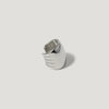 Modern silver statement ring with textured grooves on a plain white background