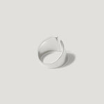 Minimalist open silver ring with smooth finish on light background