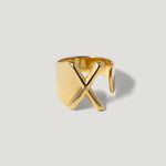 Gold adjustable ring with bold X design on matte background