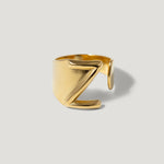 Gold adjustable ring with bold Z design on light background