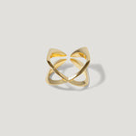 Modern open gold ring with geometric design on white background