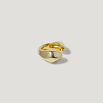 Polished gold open ring with organic, sculptural design on a white background