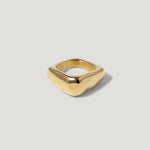 Modern gold square signet ring with smooth, minimalist design on a light background
