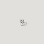 Minimalist silver spiral ear cuff on white background