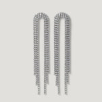 Long silver rhinestone dangle earrings with cascading strands on a plain background
