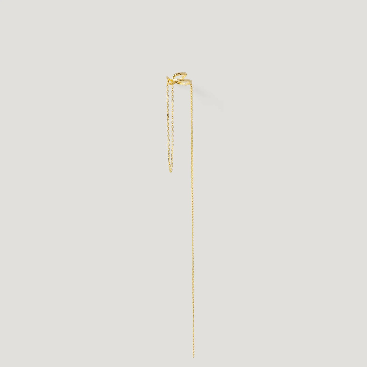 Minimalist gold chain earring with two delicate chains on a white background