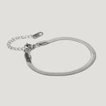 Silver snake chain bracelet with adjustable clasp on white background
