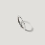 Minimalist silver hoop earring with polished finish on white background