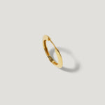 Gold hoop earring with smooth finish on white background