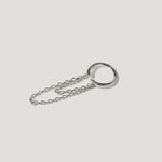 Minimalist silver chain necklace with an open circular pendant on a white background