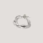 Silver twisted hoop earring with stud fastening on white background